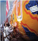 men painting the jet