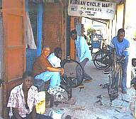 [Pic Fixing the boys' bike in town]