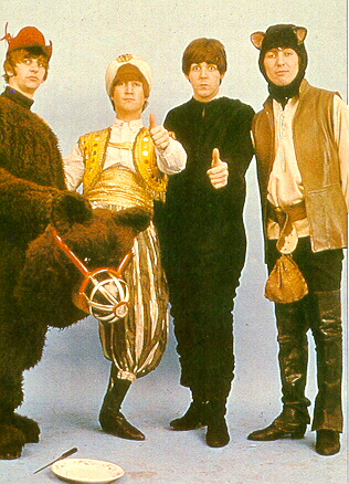 The Beatles dressed in wacky costumes.