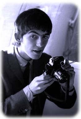 George Harrison with a camera.