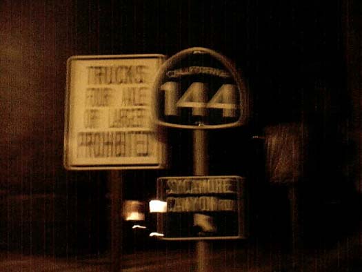 Route 144 shield at night.
