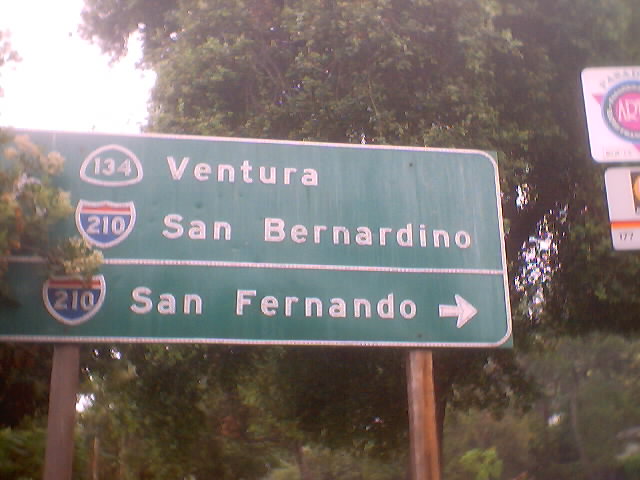 An original state-highway-standard button-copy sign from Seco Street.