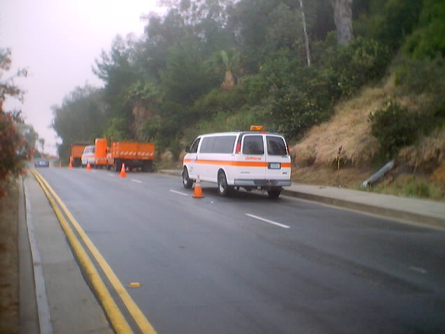 Southbound Linda Vista Avenue before former Route 159's end at San Rafael Avenue.  Here, we can see Caltrans workers doing landscaping work.  Curious.