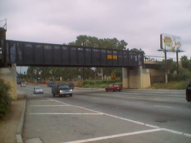A rustic bridge of a disused railway over Route 72.  No post mile markers for the bridge are installed.
