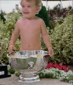 a baby with a trophy