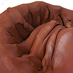 Clay being spiral wedged