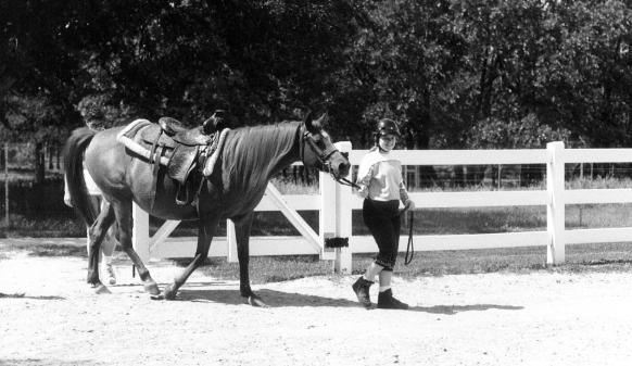 Emma leads her horse