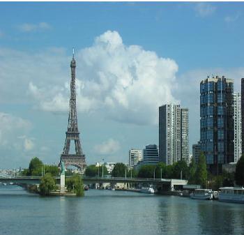 The Eiffel tower with the Statue of Liberty in the foreground.