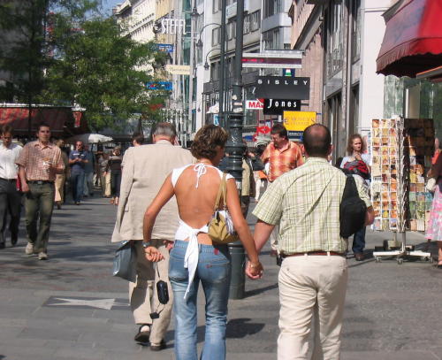 Fashion or what... and who is she holding hands with??