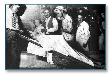 Even in death, the Dillinger mystique was attributed with another larger-than-life quality when a post-mortem photograph suggested that he had an extraordinarily large penis. However, the official explanation for the anomaly is that, under the shrouding sheet, one of Dillinger's arms was locked into the suggestive position due to rigor mortis. So this ''gun,'' too, while not being made of carved wood and shoe polish, was yet just another illusion.