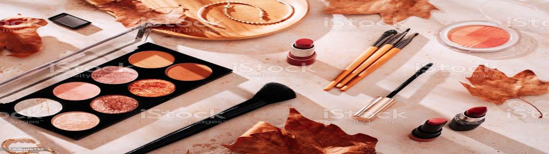 Autumn skincare and autumn makeup concept with beauty products on table Beauty products and makeup, autumn leaves on beige background. Autumn skincare and autumn makeup concept. Make-Up Stock Photo