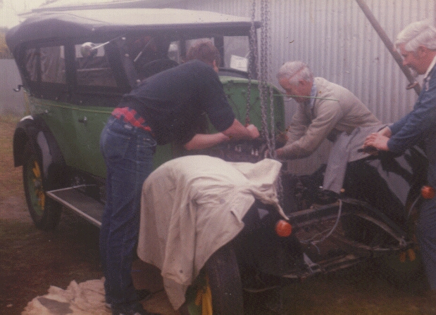 picture of some members of the Creaser family tuning the engine