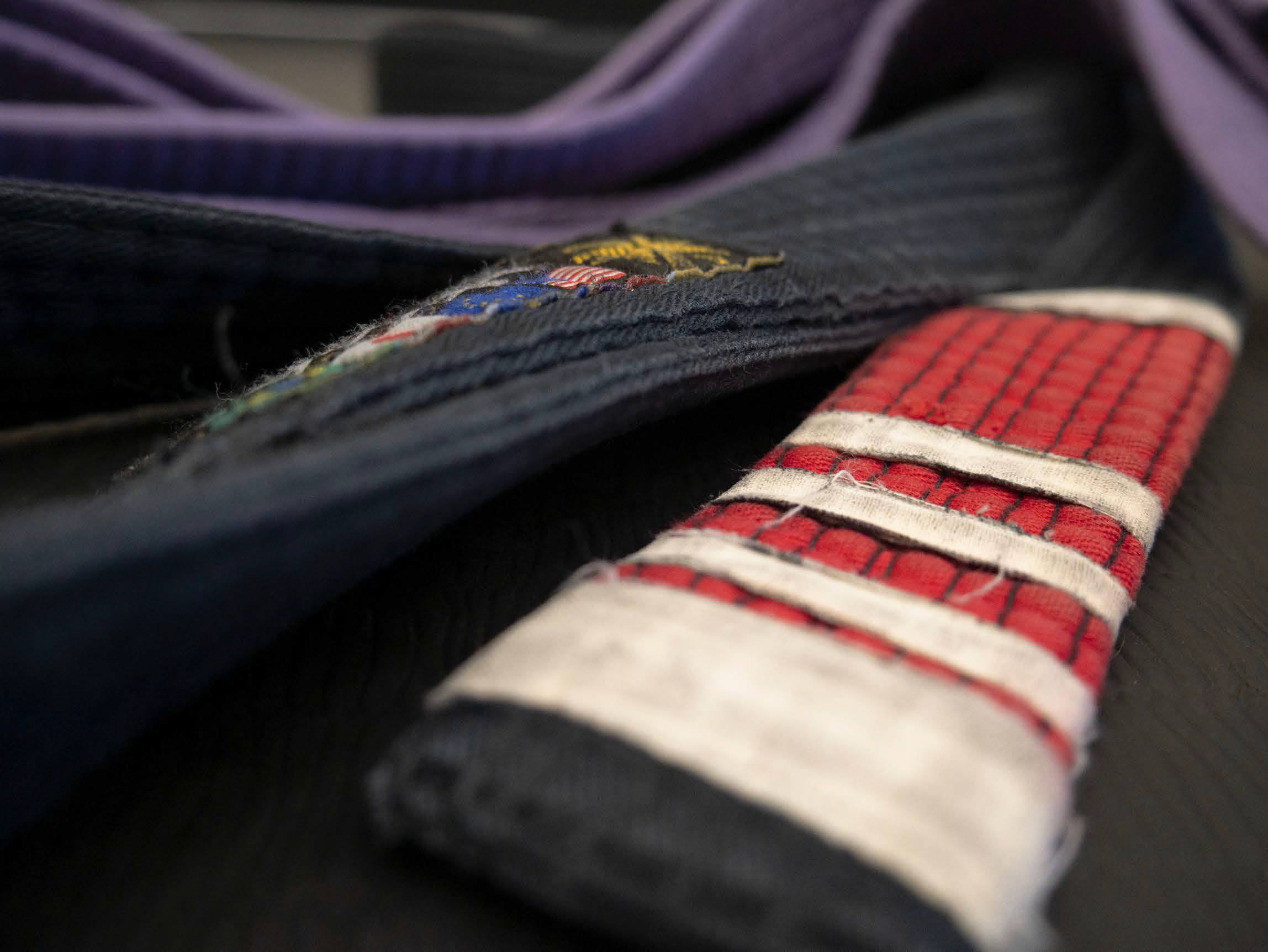Bjj black belt photo. Black, purple, white, red.