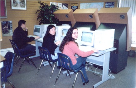 Erica, Brazilian, 24 years old, Administrator, on the right of lab multimedia with a Korean classmate: