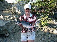 Crystal with her first ever Pink Salmon Catch at Montana Creek Alaska 3 Aug 02