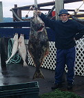 Dustin Draper with 80pound Halibut Alaska