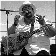 Don Jibaro- spreading the word with his Borinquen shaped quatro