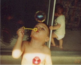 Louis loves to blow bubbles in the summertime