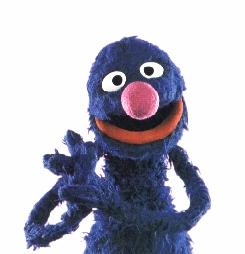 Grover, blue, furry, lovable, and wise