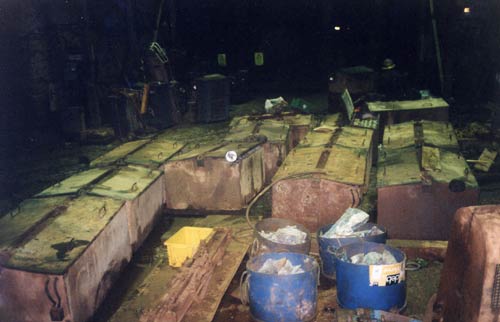Loco batteries waiting to be lifted out of Cook's shaft, South Crofty.