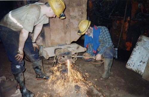 Applying heat to a wagon's towing equipment, South Crofty.