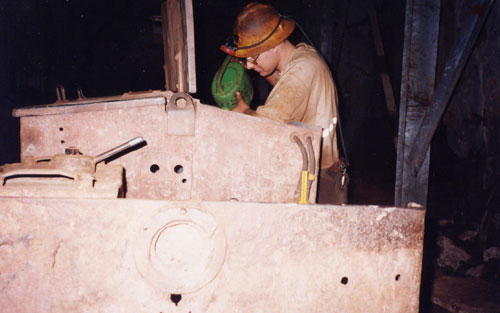 Topping up the battery of a  small loco at South Crofty.