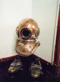 Divers helmet and boots on display Main Office - 2002