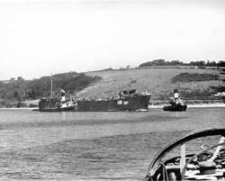 L.C.T. being towed to dry-dock