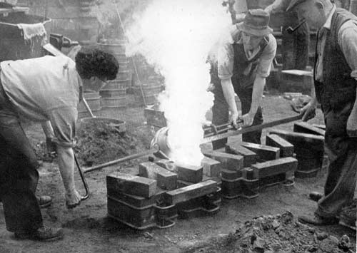 Moulders pouring metal, circa 1946