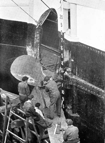 Working on a Ship's propeller. Falmouth Docks circa 1946.