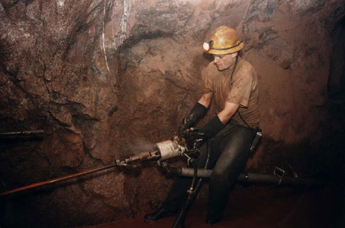Photo of a Cornish tin miner shot underground at South Crofty.