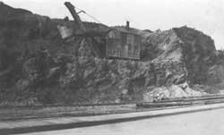 Steam Navvie excavating cliff. circa 1954