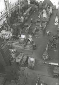 Fitting shop from overhead crane showing pistons etc circa 1960's
