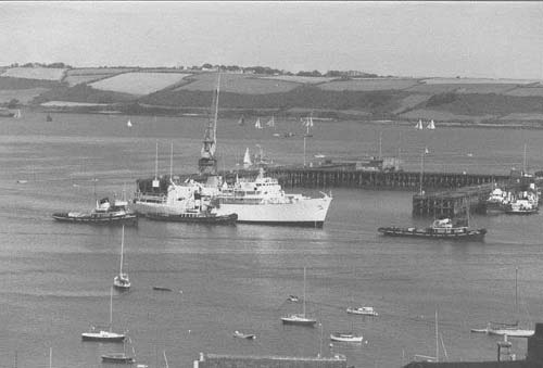 H.M.S. Hecate (Survey vessel) being towed by local tugs. Falmouth Docks circa 1980's.