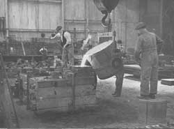 Moulder's Shop.  Workers pouring molten metal.  circa 1946