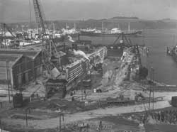 Moving Crane from East Side of Dock.  circa 1956