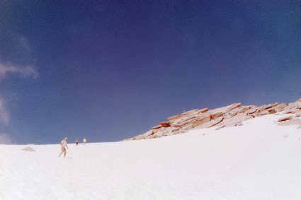 Descending the snow slope just below Alta Peak's summit