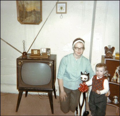 1965. Look at Mom's groovy headband and my ungroovy plaid vest. 