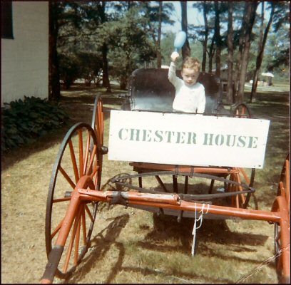 Aug. 1966. Me in a hay wagon holding a balloon.  We stayed at Chester House in the Pocono Mountains.