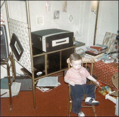 Christmas 1965. Me in my new rocking chair after tearing thought my Christmas presents.
