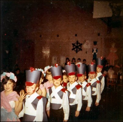 Christmas 1967. Me as a wooden soldier in a kindergarten pageant at PS 152 in Brooklyn. My partner is Gail Holler. 