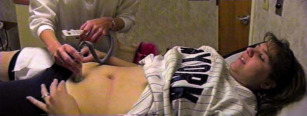 This is a photo of Cindy with the 
monitor on her stomach.