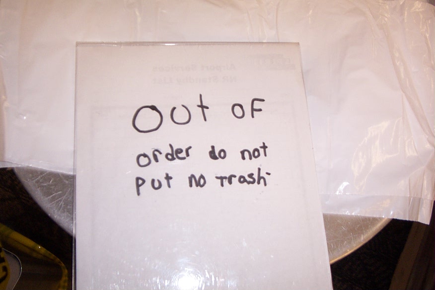 Only in Detroit would you see A) a broken garbage can and B) such awful grammar