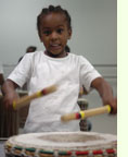 young boy drumming