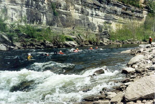 Swimmers Entering Rapids