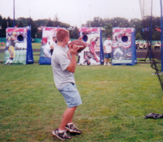 Tossing a football at the Pro Football Hall of Fame festivities.