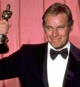 CHUCK HOLDING HIS SECOND OSCAR-'77
