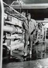 CHUCK LOOKING THROUGH THE SOYLENT GREEN FACTORY