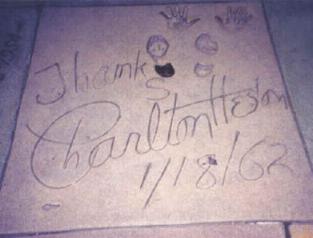 CHUCK'S SIGNATURE AND FOOT-HANDPRINTS