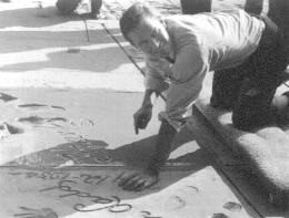 Chuck Signs his name in cement at GraumansChineseTheatre